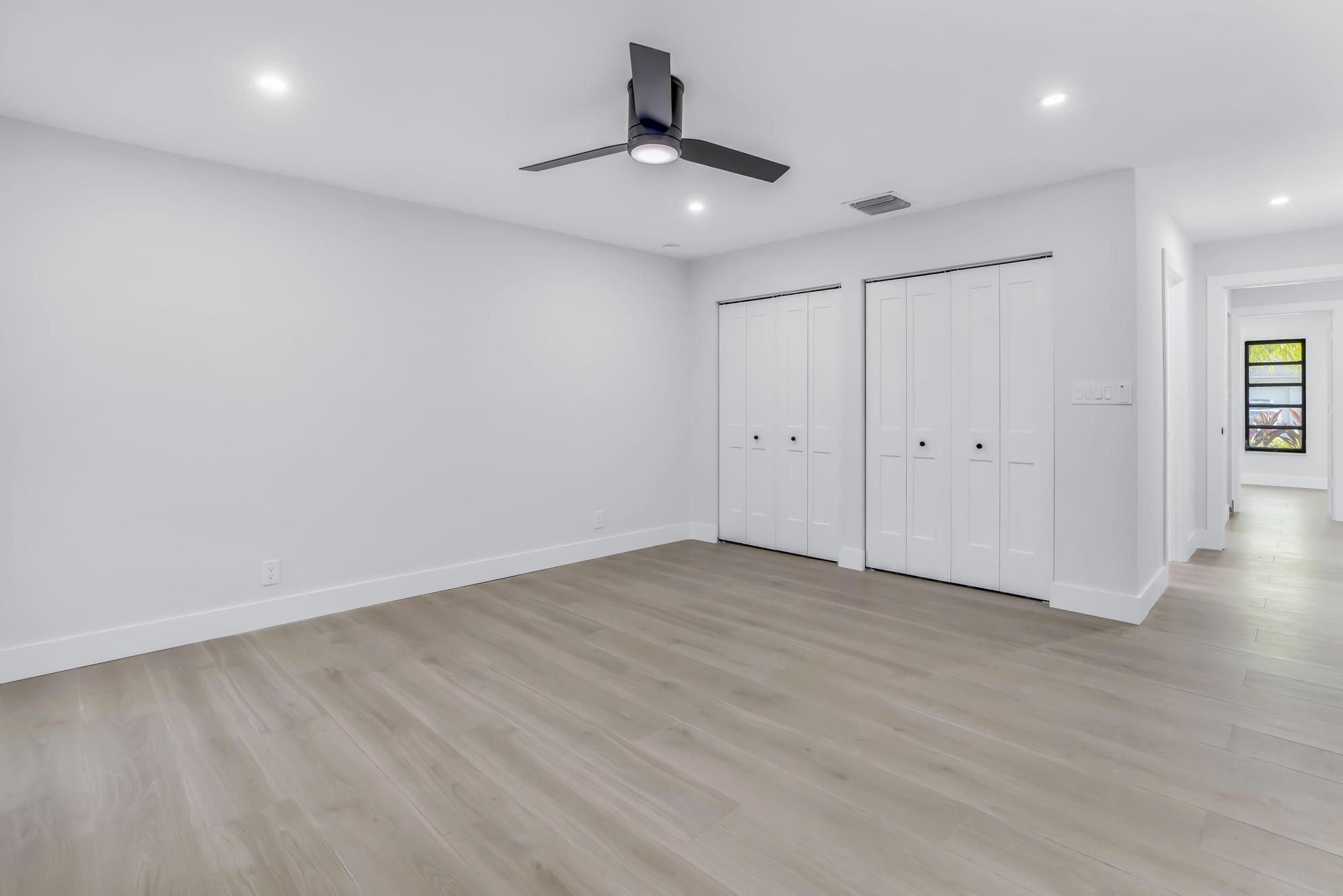 18089 103rd Trail South Boca Raton, FL 33498 - Photo 31 of 51 a view of an empty room with wooden floor