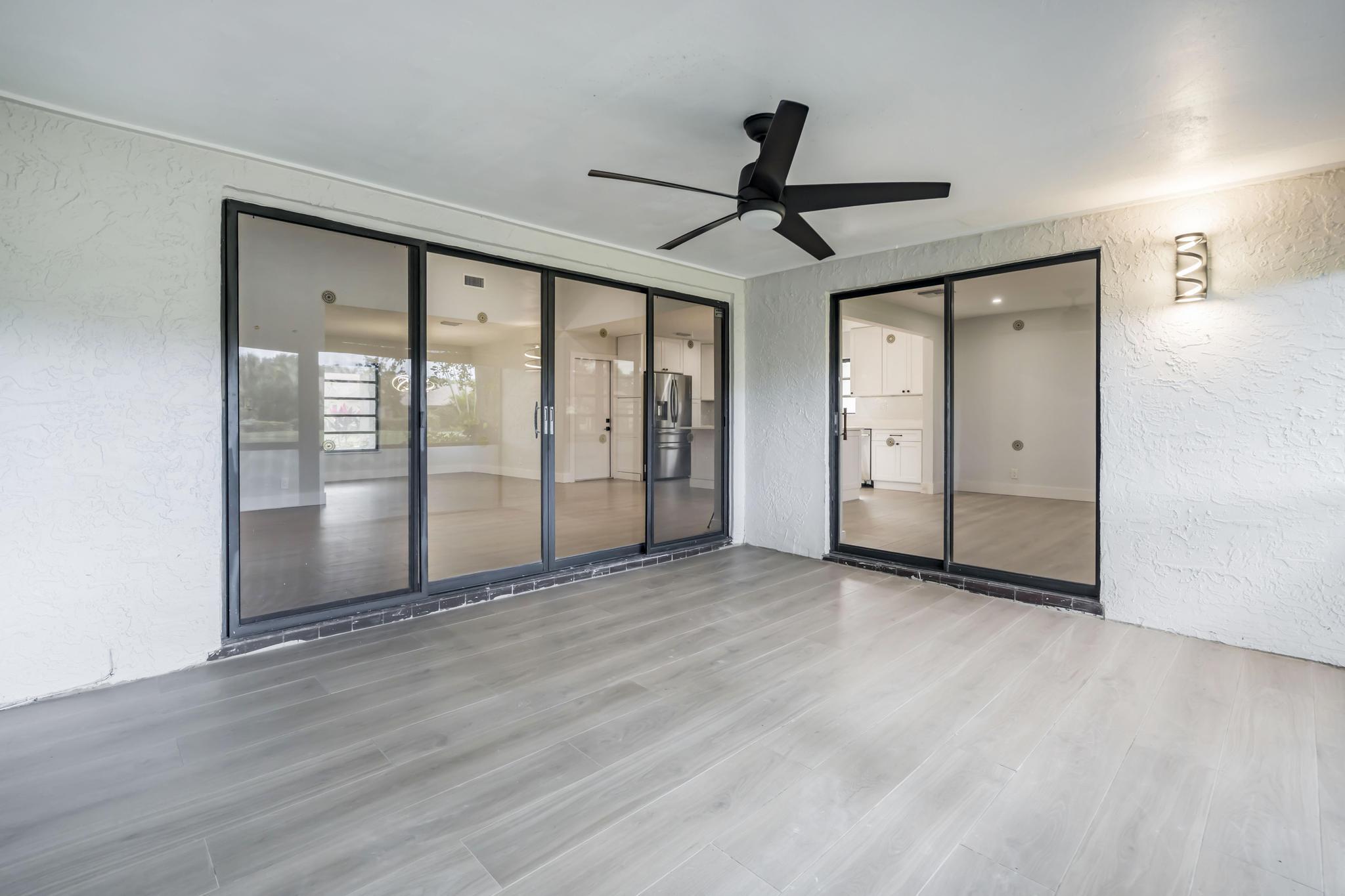 18089 103rd Trail South Boca Raton, FL 33498 - Photo 33 of 51 a view of empty room with wooden floor and fan