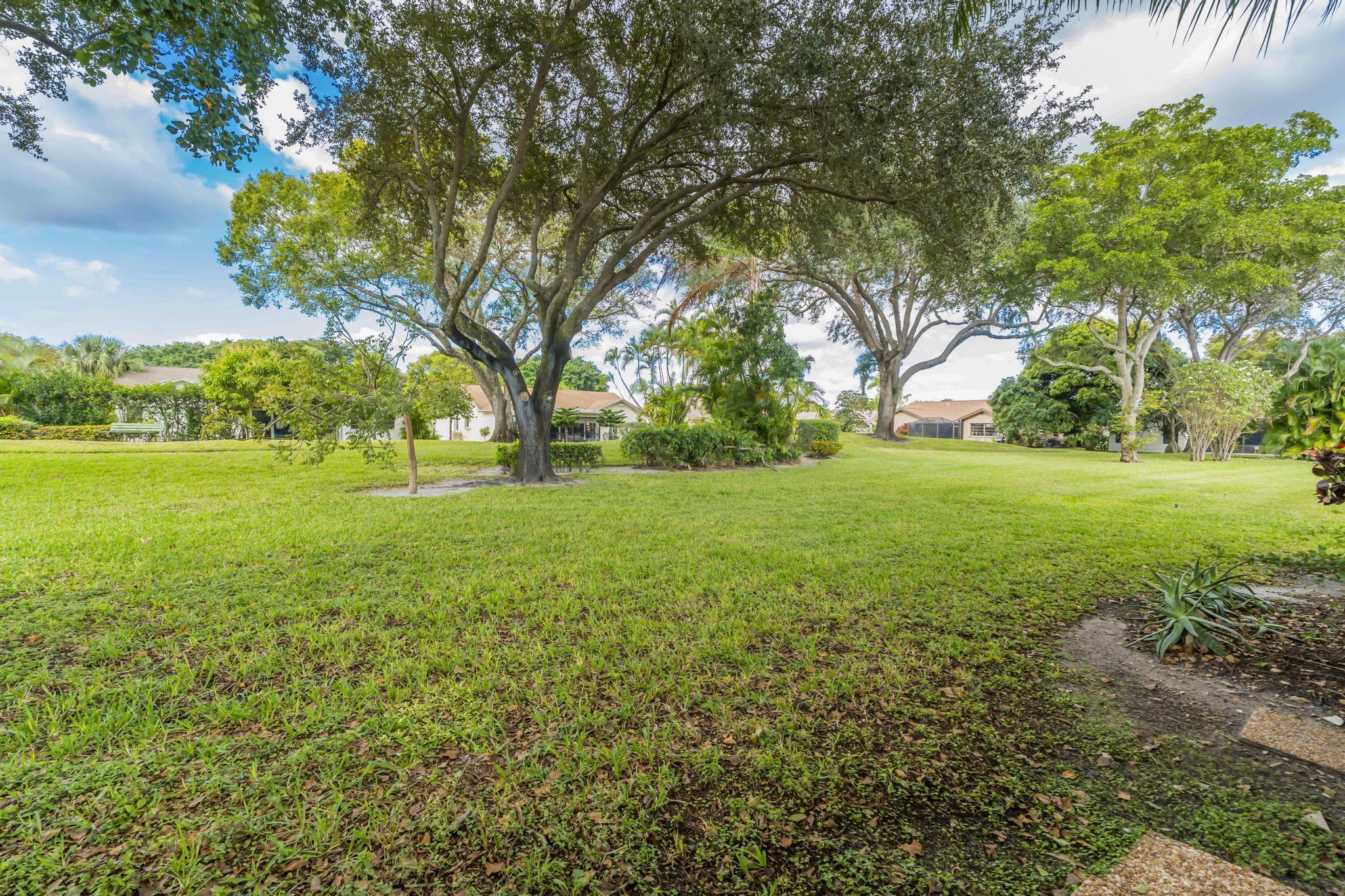 18089 103rd Trail South Boca Raton, FL 33498 - Photo 44 of 51 a view of a field with a tree