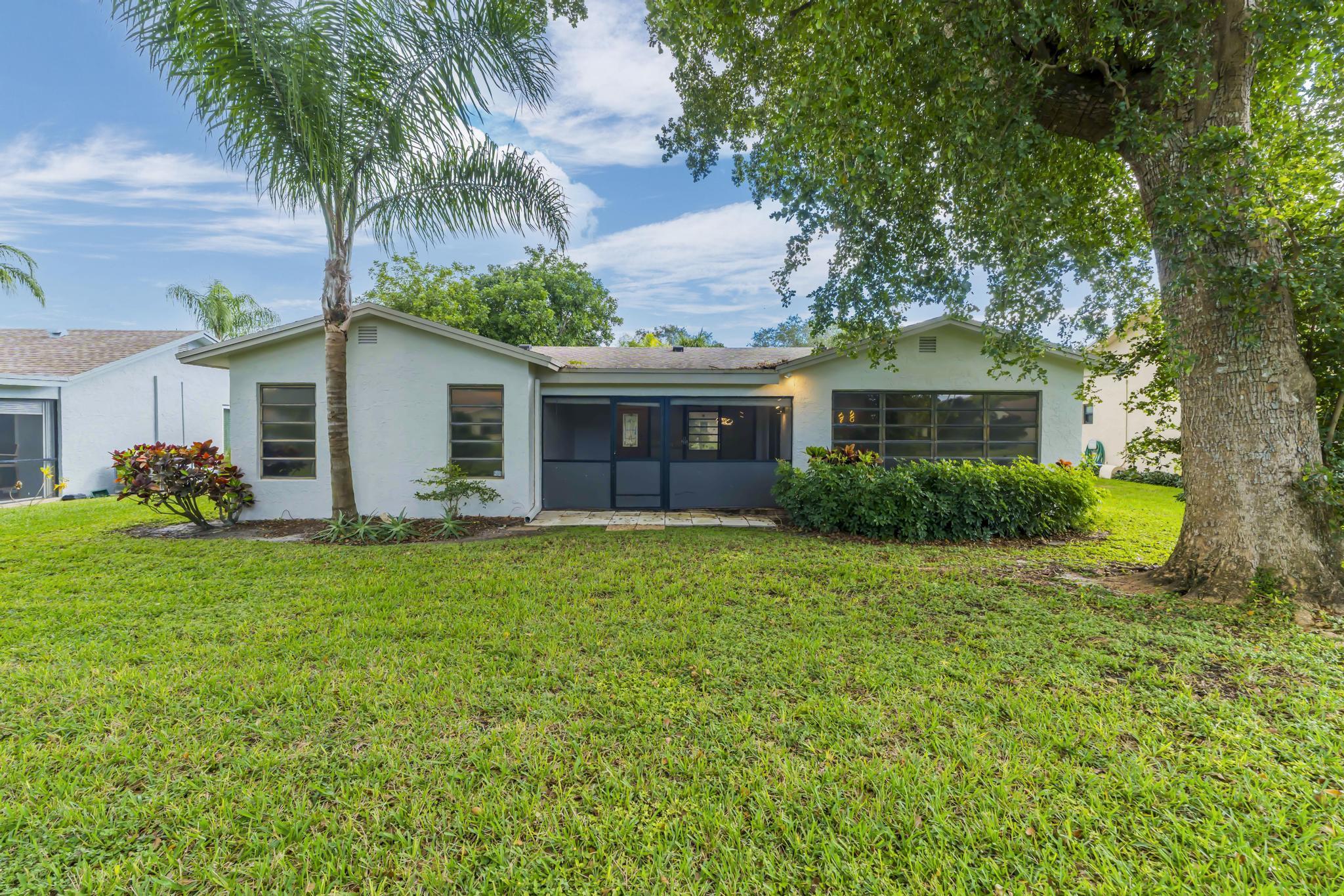 18089 103rd Trail South Boca Raton, FL 33498 - Photo 45 of 51 a front view of house with yard and green space