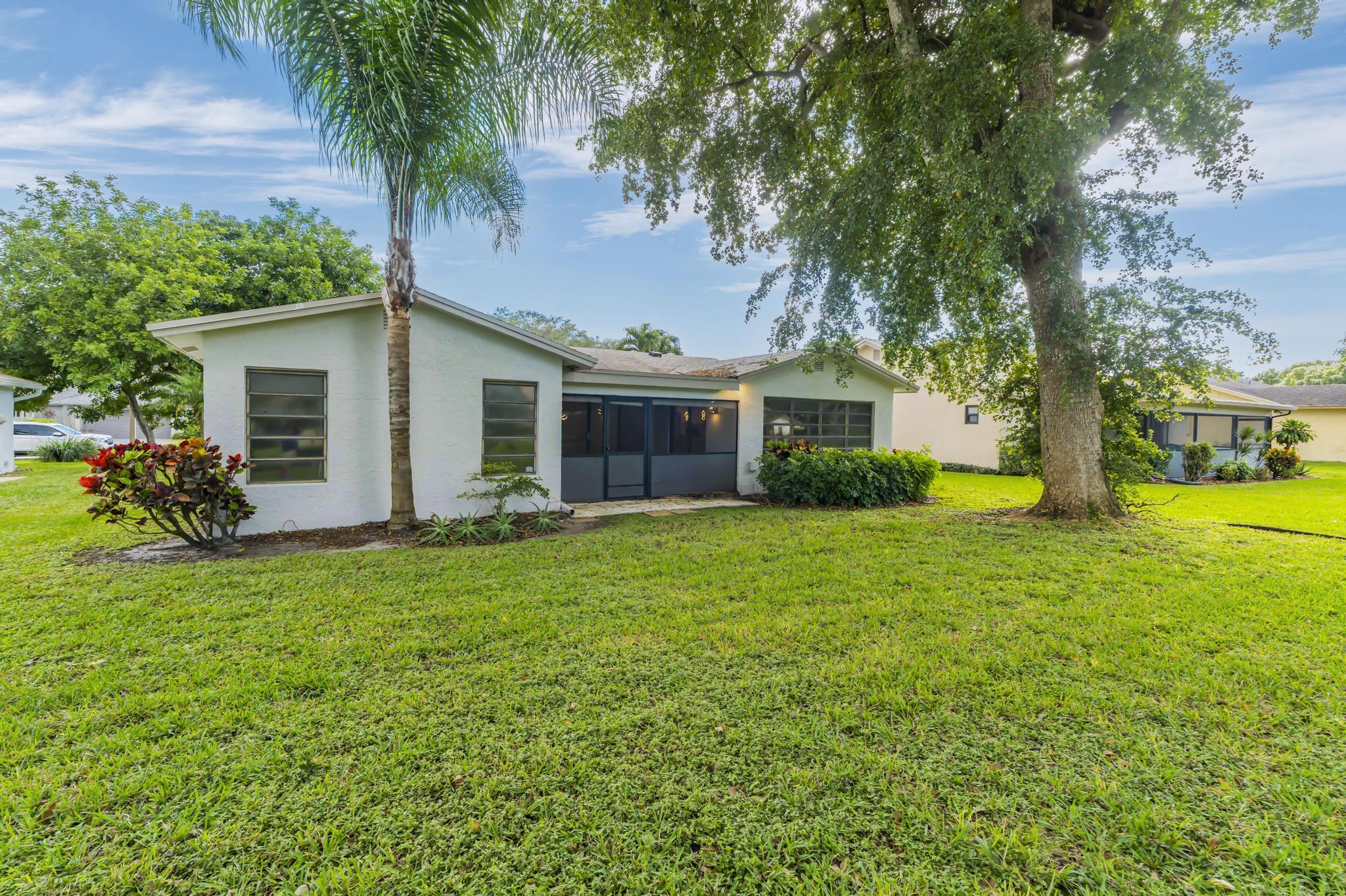 18089 103rd Trail South Boca Raton, FL 33498 - Photo 46 of 51 a front view of house with yard and green space