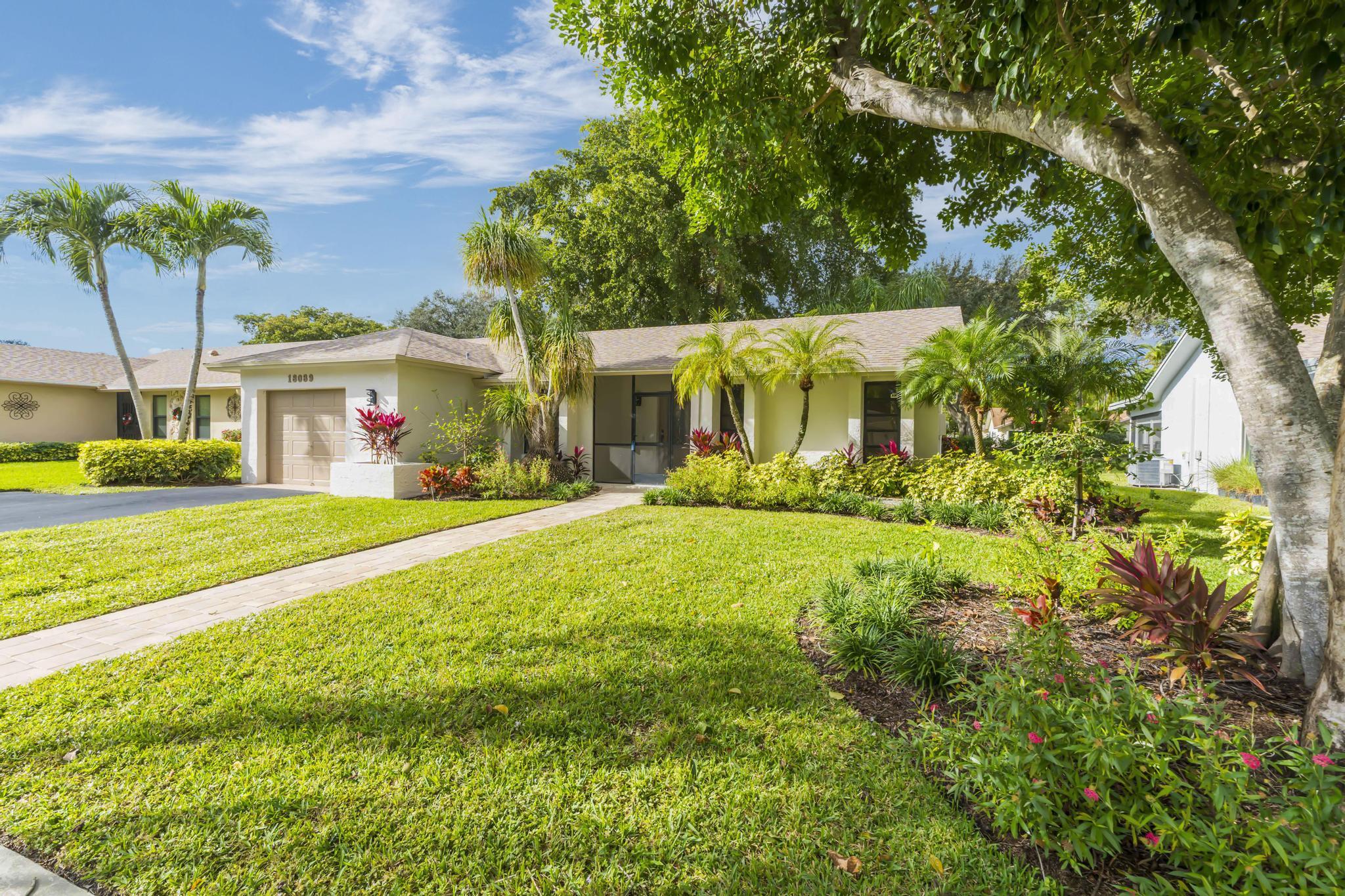 18089 103rd Trail South Boca Raton, FL 33498 - Photo 50 of 51 a view of an house with backyard and garden