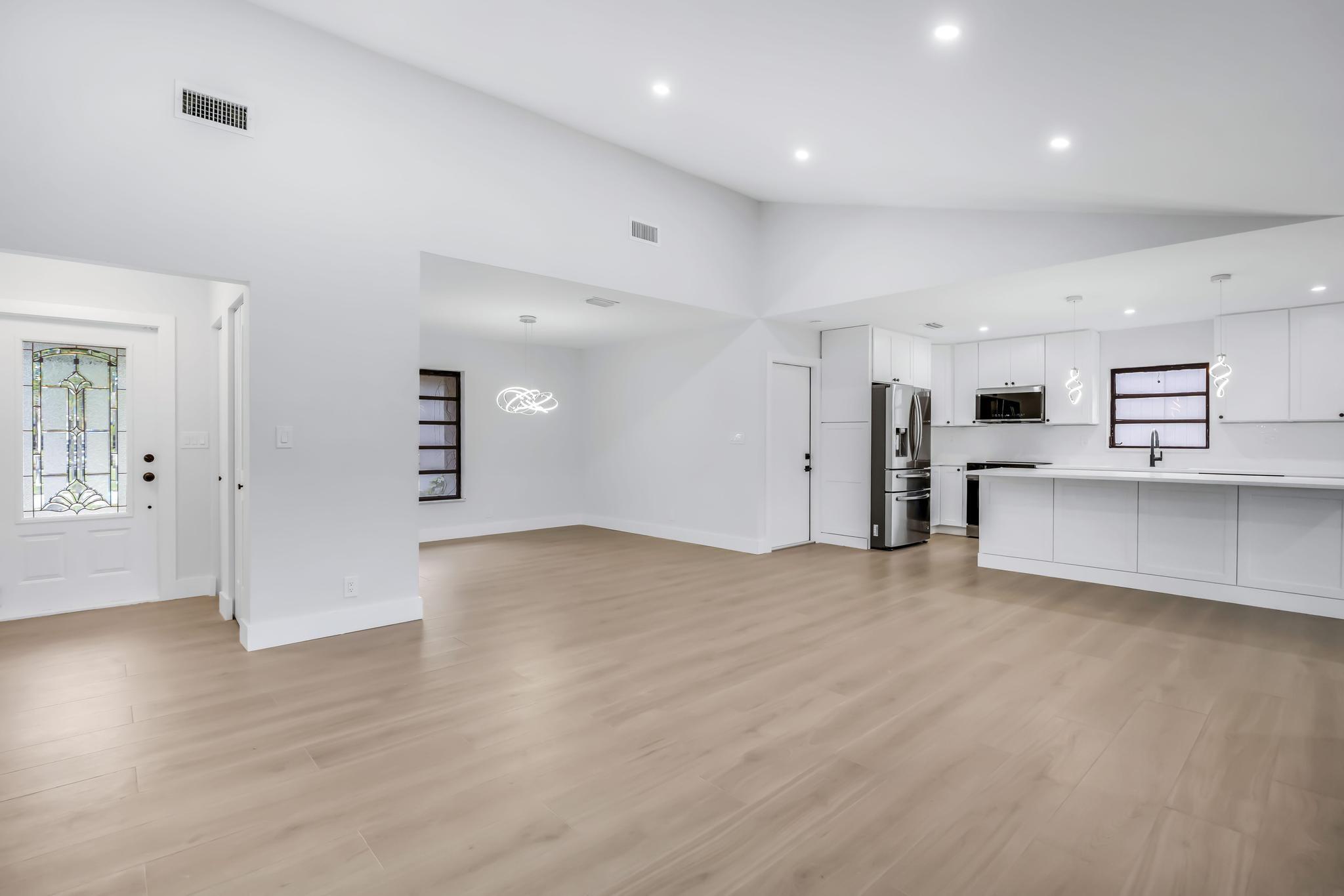 18089 103rd Trail South Boca Raton, FL 33498 - Photo 7 of 51 a view of a kitchen with a sink and a refrigerator