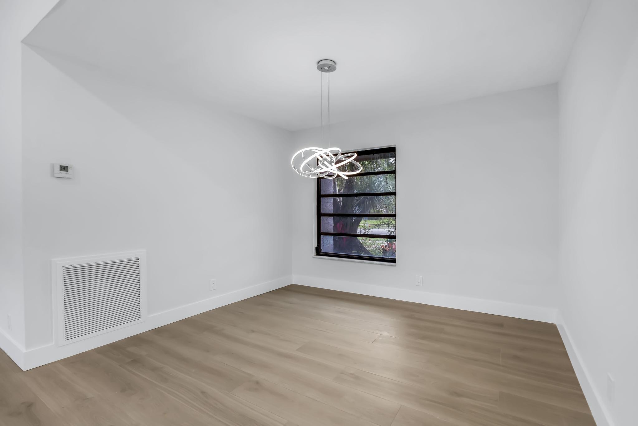 18089 103rd Trail South Boca Raton, FL 33498 - Photo 9 of 51 a view of wooden floor and windows in a room