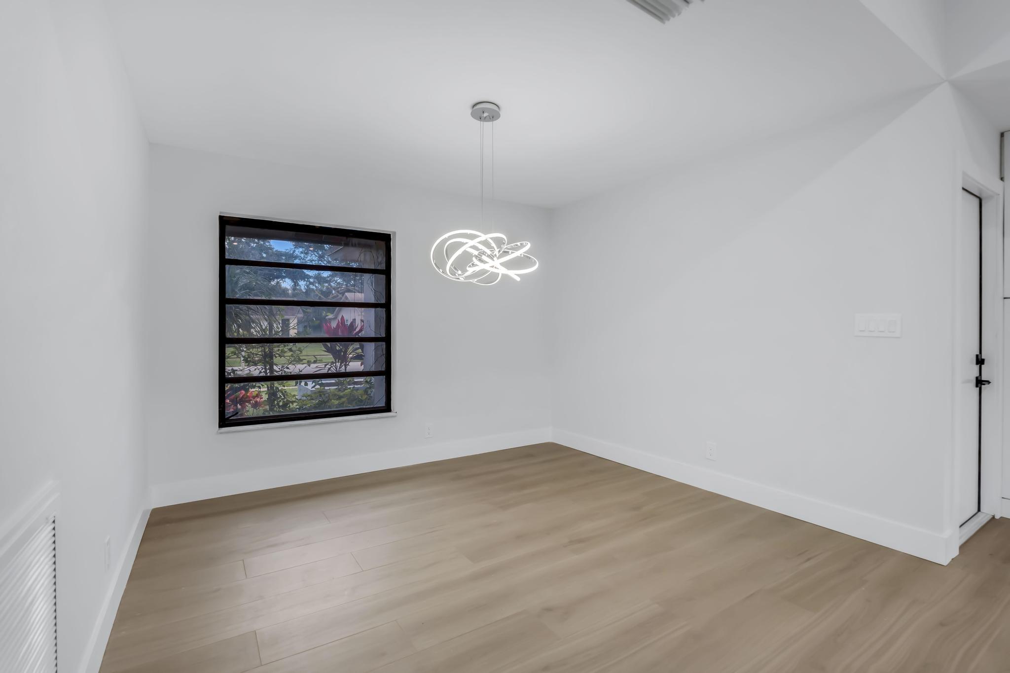 18089 103rd Trail South Boca Raton, FL 33498 - Photo 10 of 51 wooden floor in an empty room