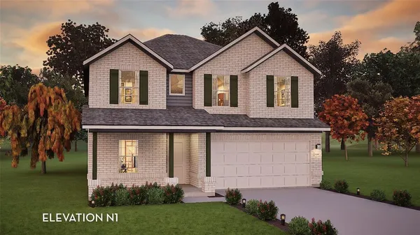 a view of a yard in front of a house with a large tree