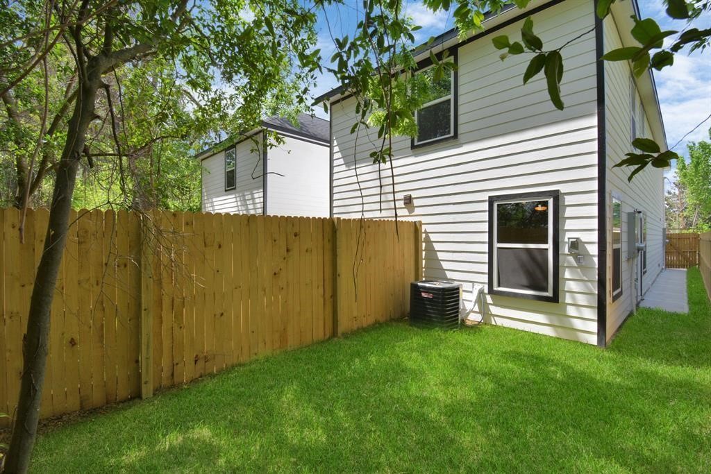 7413 Shotwell Street, Unit A Houston, TX 77028 - Photo 15 of 17 a view of a backyard with plants