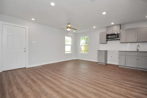 a view of kitchen with microwave and window