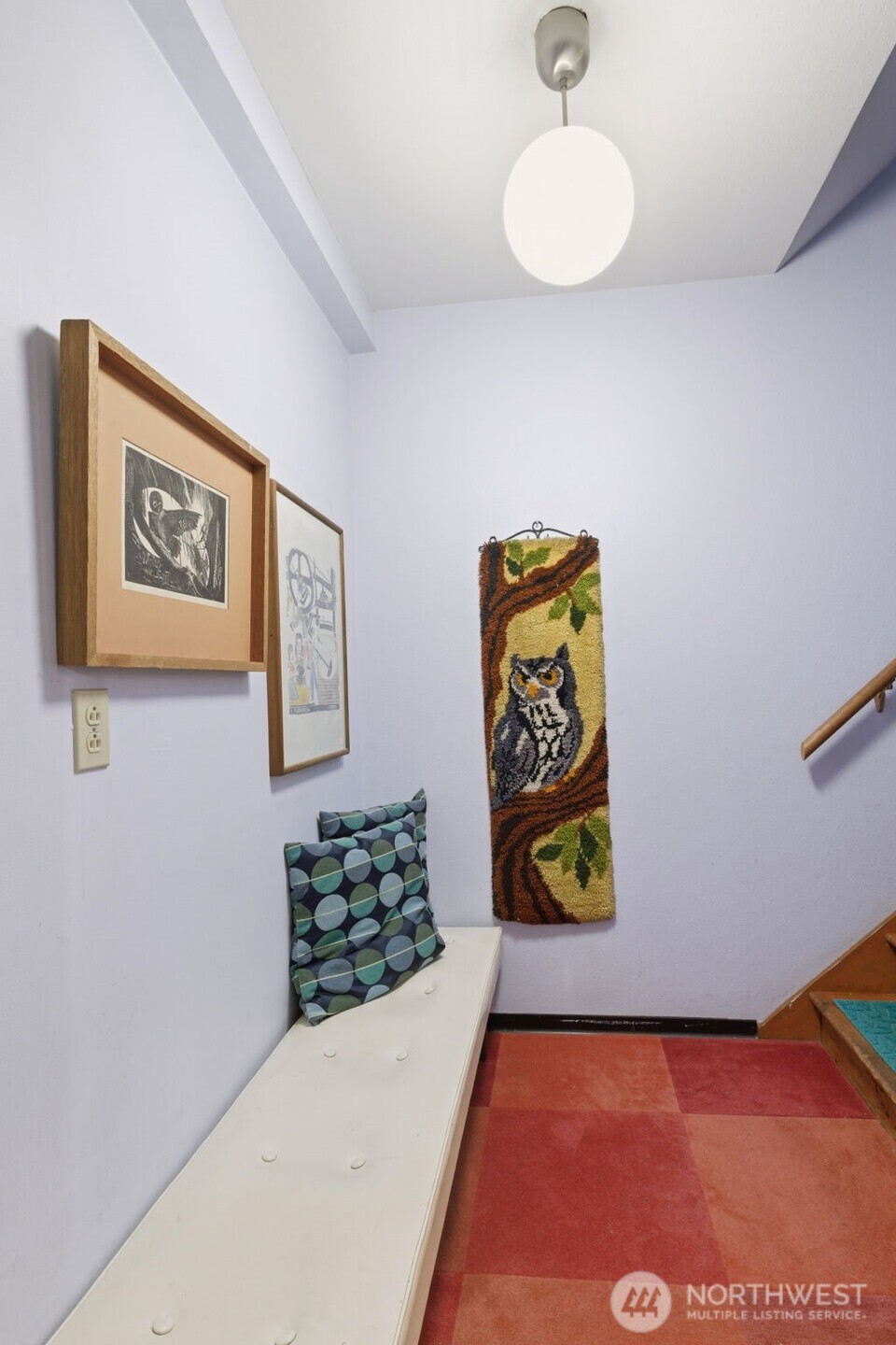 2803 South Walker Street Seattle, WA 98144 - Photo 37 of 40 a view of a hallway with paintings on the wall