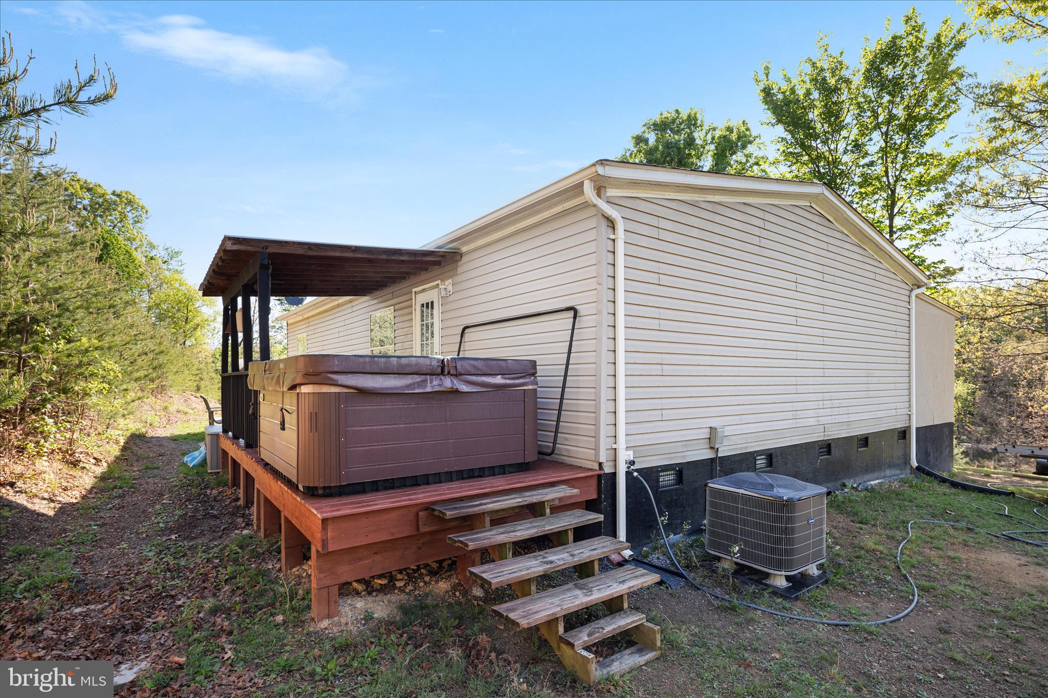 775 Pack Horse Road Winchester, VA 22603 - Photo 5 of 28 a view of a back yard with a bench