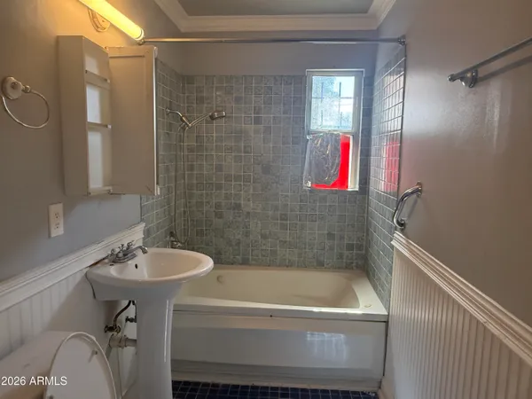 a bathroom with a sink and a bathtub