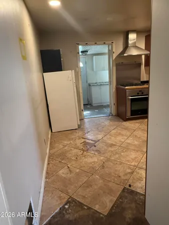 a kitchen with a stove and a sink