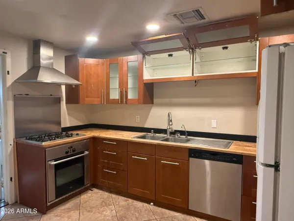 a kitchen with a stove and a sink