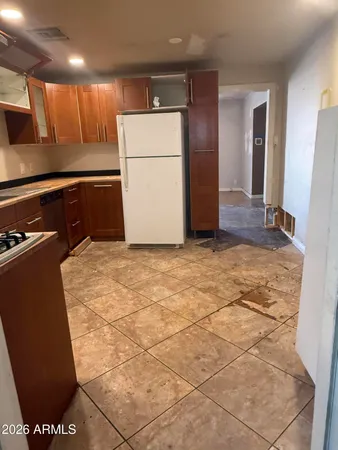a kitchen with a sink and a stove