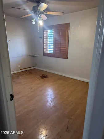 a view of an empty room with a window