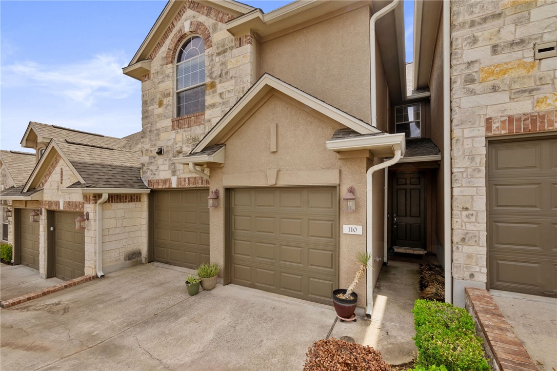 110 Sunrise Ridge Loop, Unit 1402 Austin, TX 78738 - Photo 1 of 1 Beautiful masonry front with brick and stone feature. Private entrance
