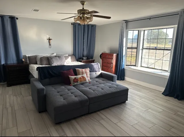 a living room with furniture and a window