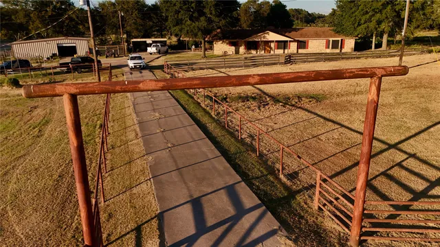a view of a swimming pool with a patio