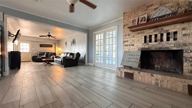 a living room with furniture and a fireplace