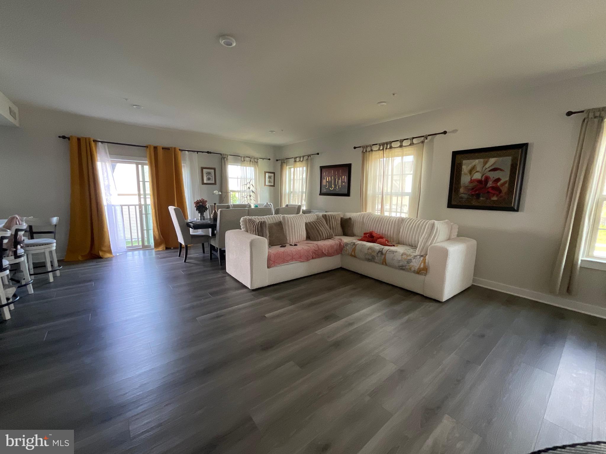 14724 Silver Hammer Way Brandywine, MD 20613 - Photo 4 of 5 a living room with furniture and a wooden floor