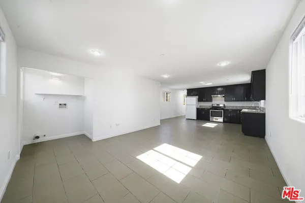 a view of kitchen with furniture and window