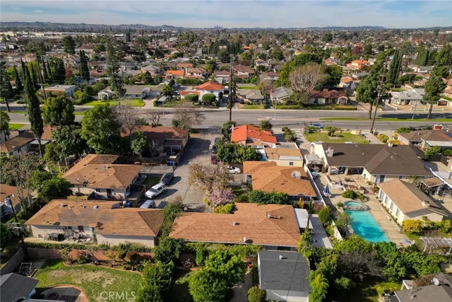 an aerial view of a house with a yard
