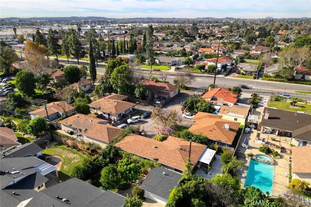 an aerial view of residential houses with outdoor space