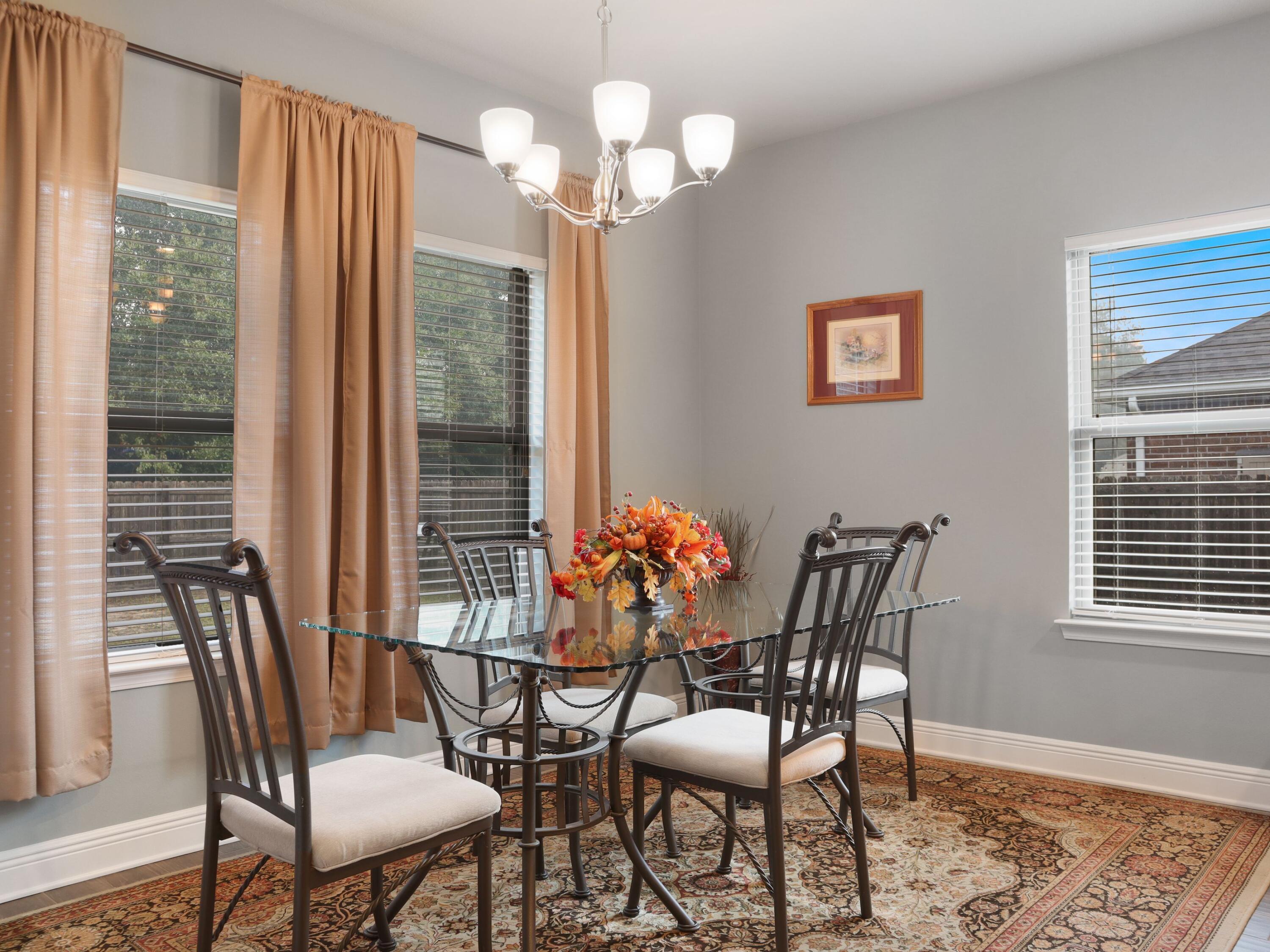4753 Dupont Circle Pace, FL 32571 - Photo 17 of 42 a view of a dining room with furniture and wooden floor