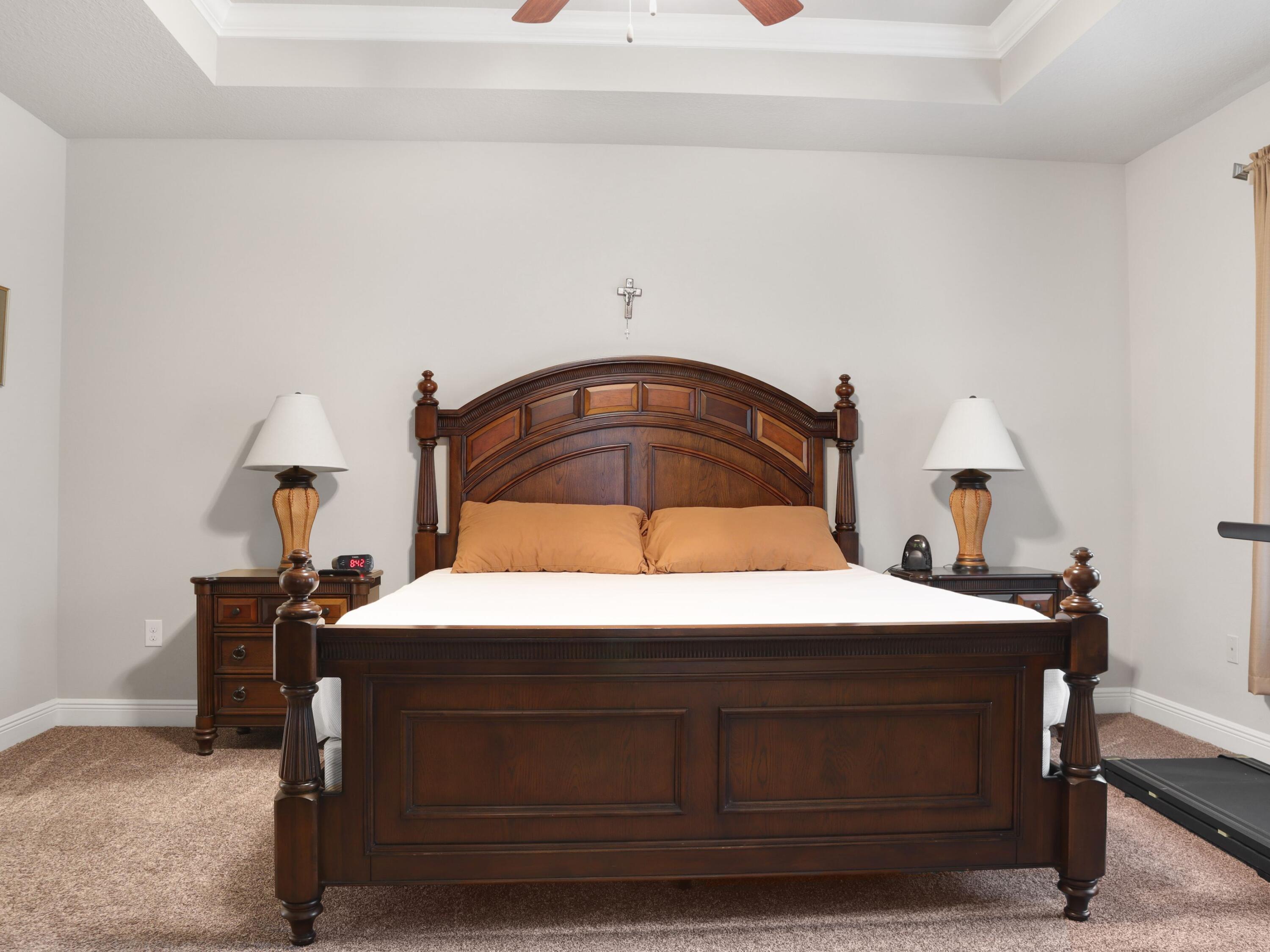 4753 Dupont Circle Pace, FL 32571 - Photo 19 of 42 a bedroom with a bed and a lamp