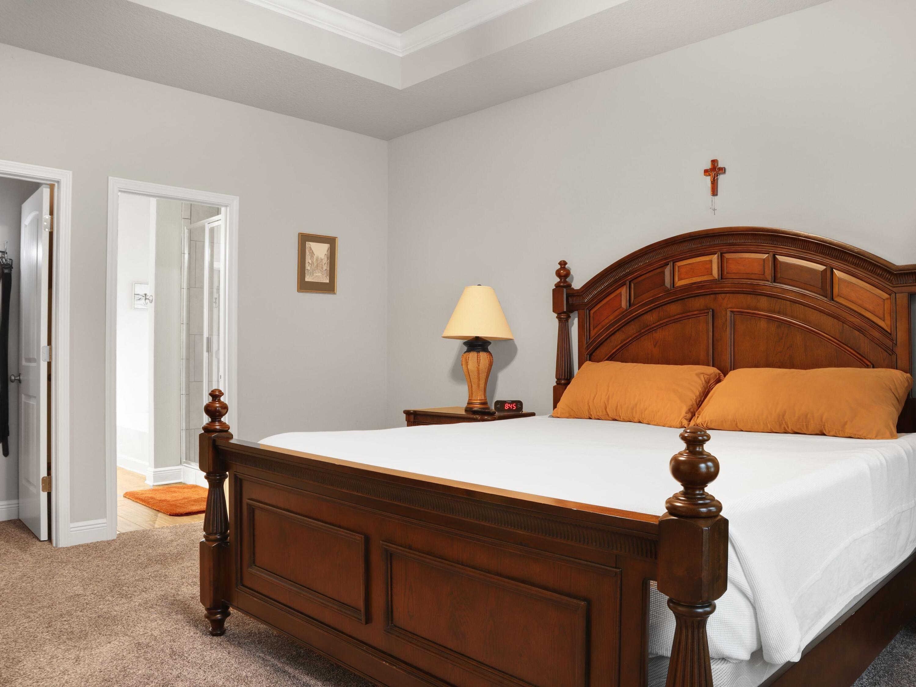 4753 Dupont Circle Pace, FL 32571 - Photo 20 of 42 a bedroom with a bed and a ceiling fan