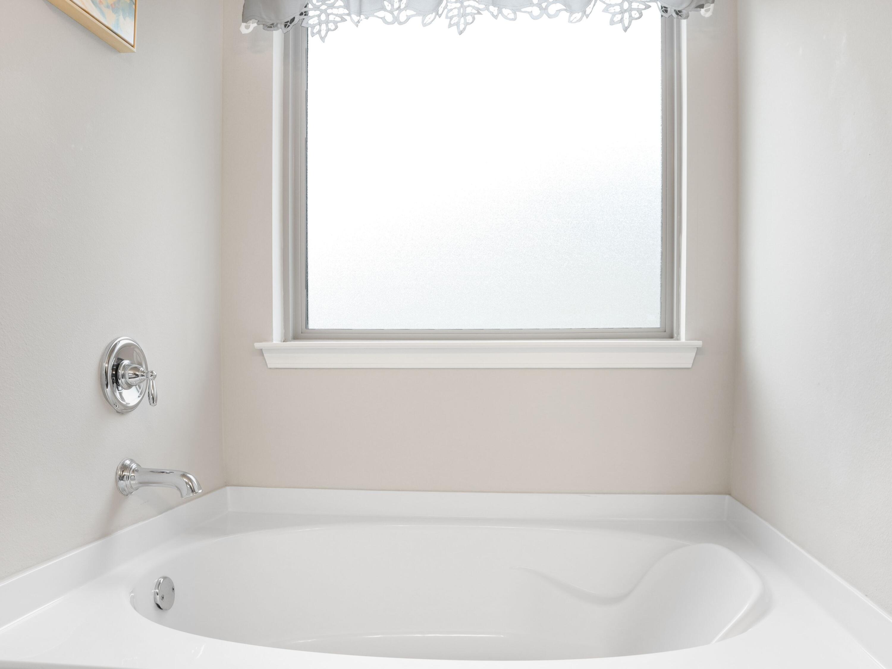 4753 Dupont Circle Pace, FL 32571 - Photo 24 of 42 a white bath tub sitting in a bathroom