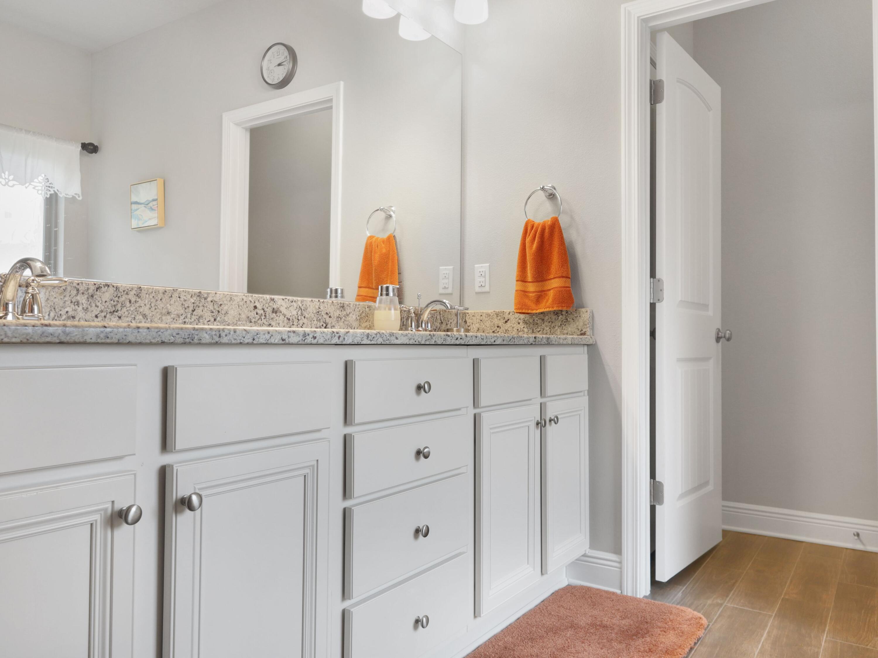 4753 Dupont Circle Pace, FL 32571 - Photo 25 of 42 a en suite bathroom with a granite countertop sink and a mirror