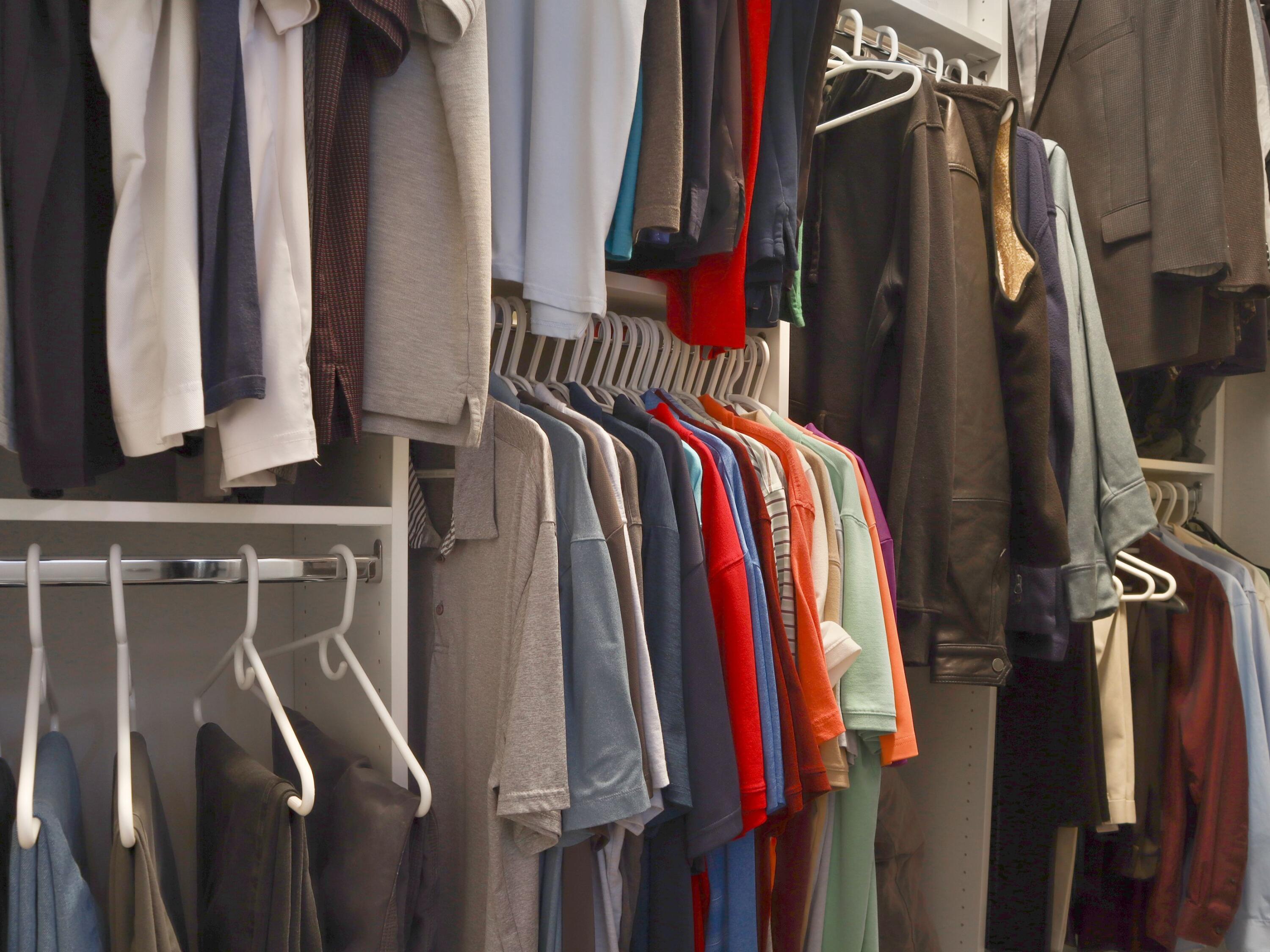 4753 Dupont Circle Pace, FL 32571 - Photo 26 of 42 a view of walk in closet with clothes and shoes