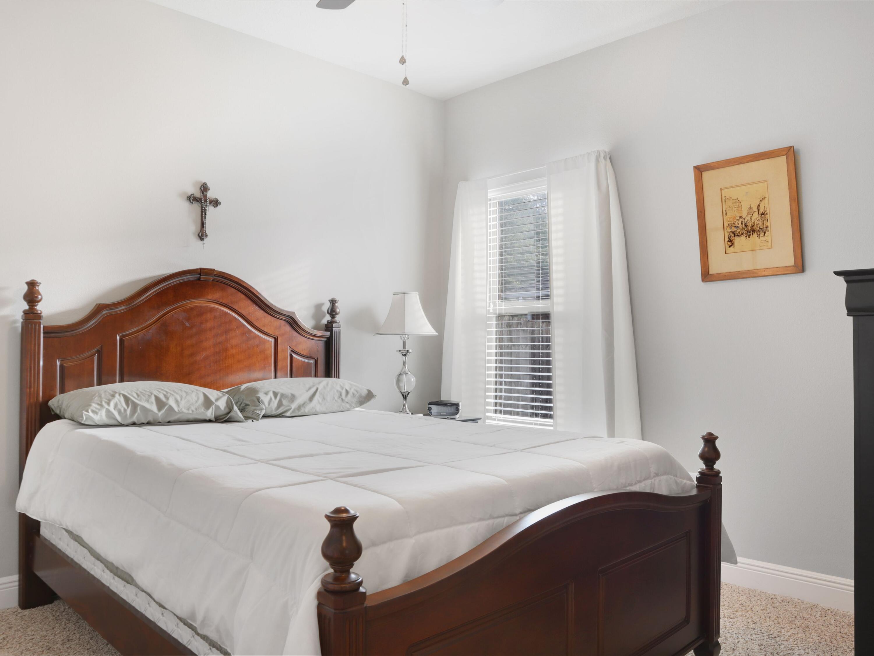 4753 Dupont Circle Pace, FL 32571 - Photo 27 of 42 a bedroom with a bed and a window