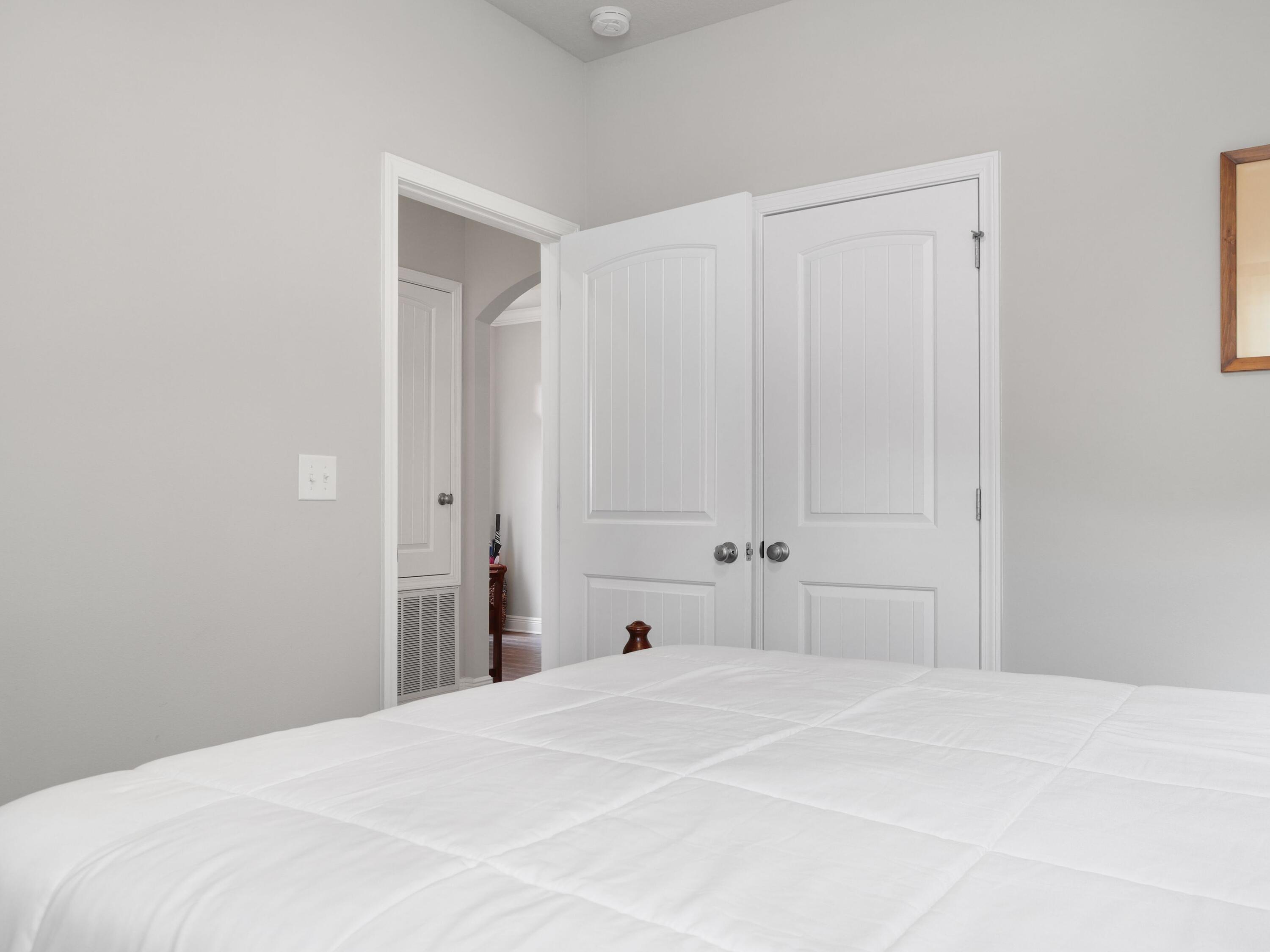 4753 Dupont Circle Pace, FL 32571 - Photo 28 of 42 a bedroom with a bed and a window