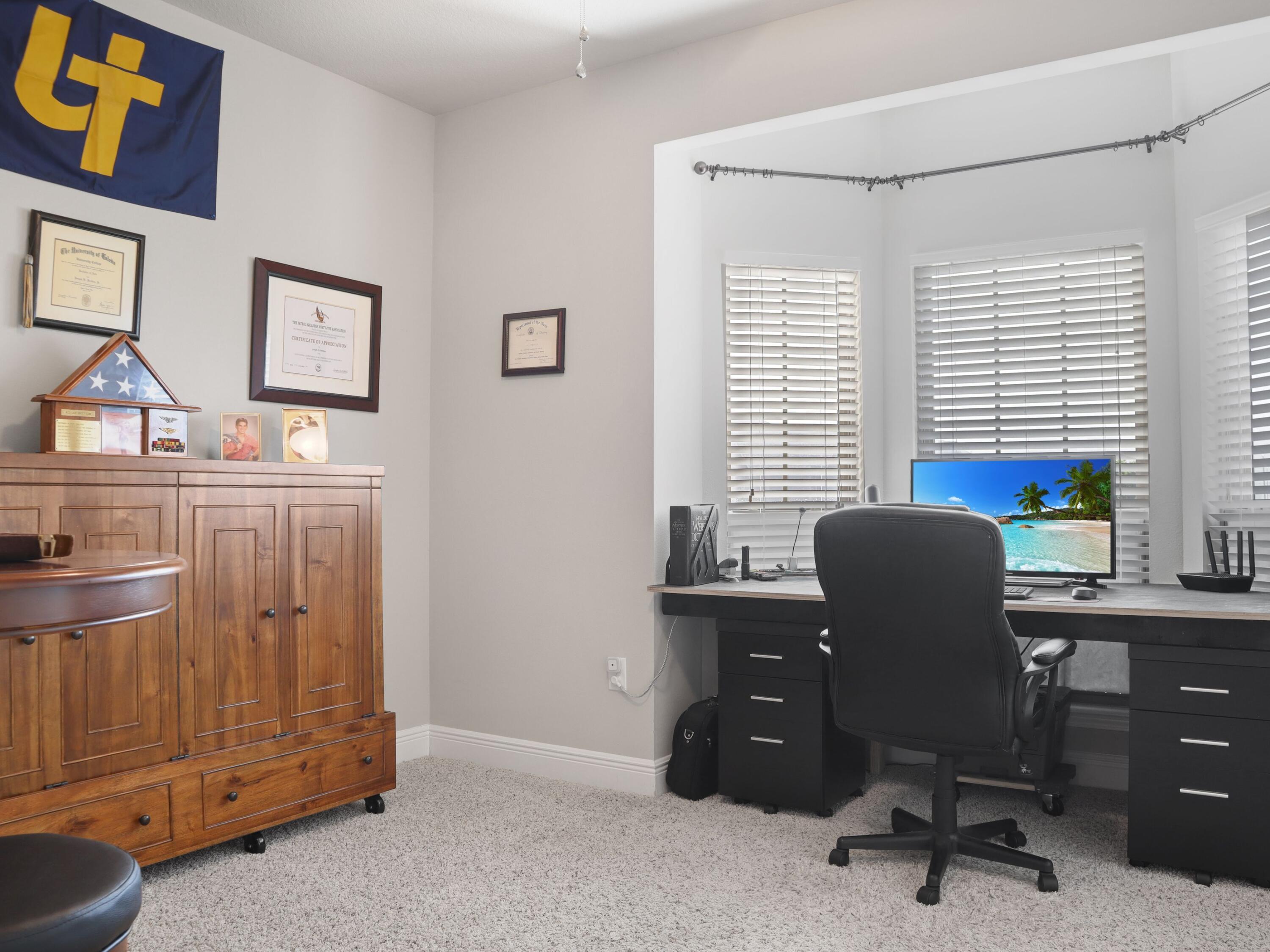 4753 Dupont Circle Pace, FL 32571 - Photo 31 of 42 a view of a workspace with furniture and a window