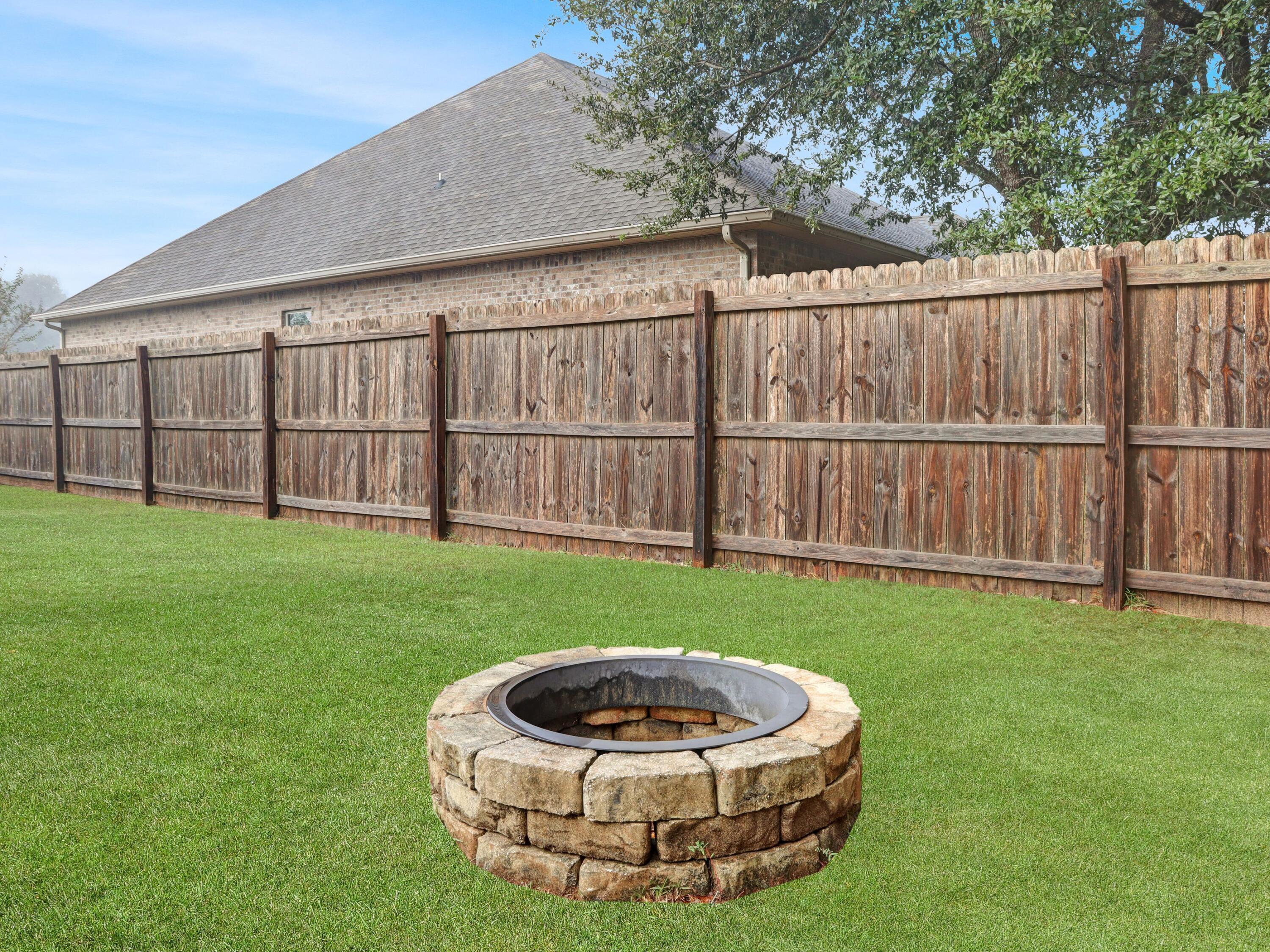 4753 Dupont Circle Pace, FL 32571 - Photo 40 of 42 a view of a backyard with a tub