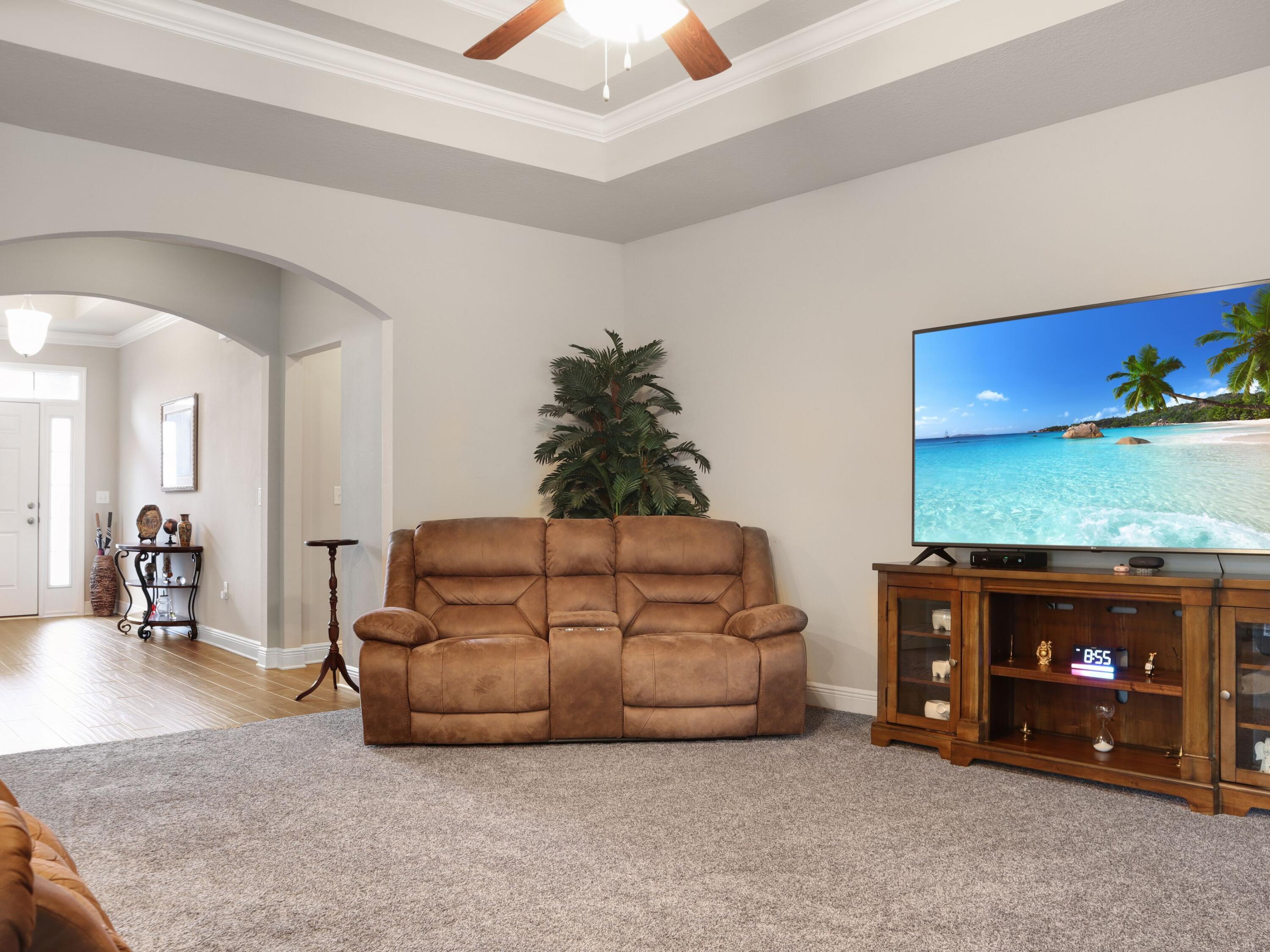 4753 Dupont Circle Pace, FL 32571 - Photo 9 of 42 a living room with furniture and a fireplace