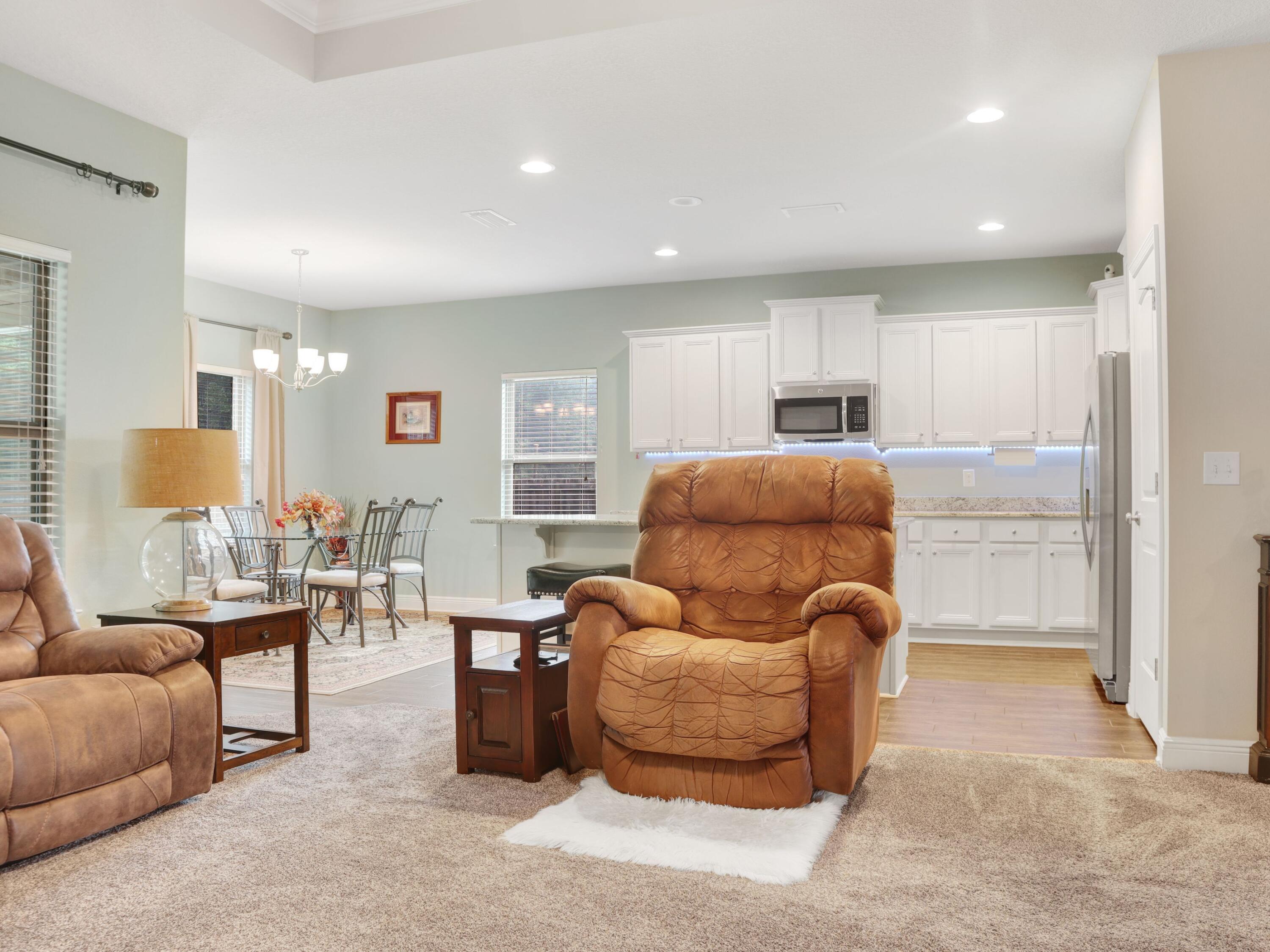 4753 Dupont Circle Pace, FL 32571 - Photo 10 of 42 a living room with furniture and a large window