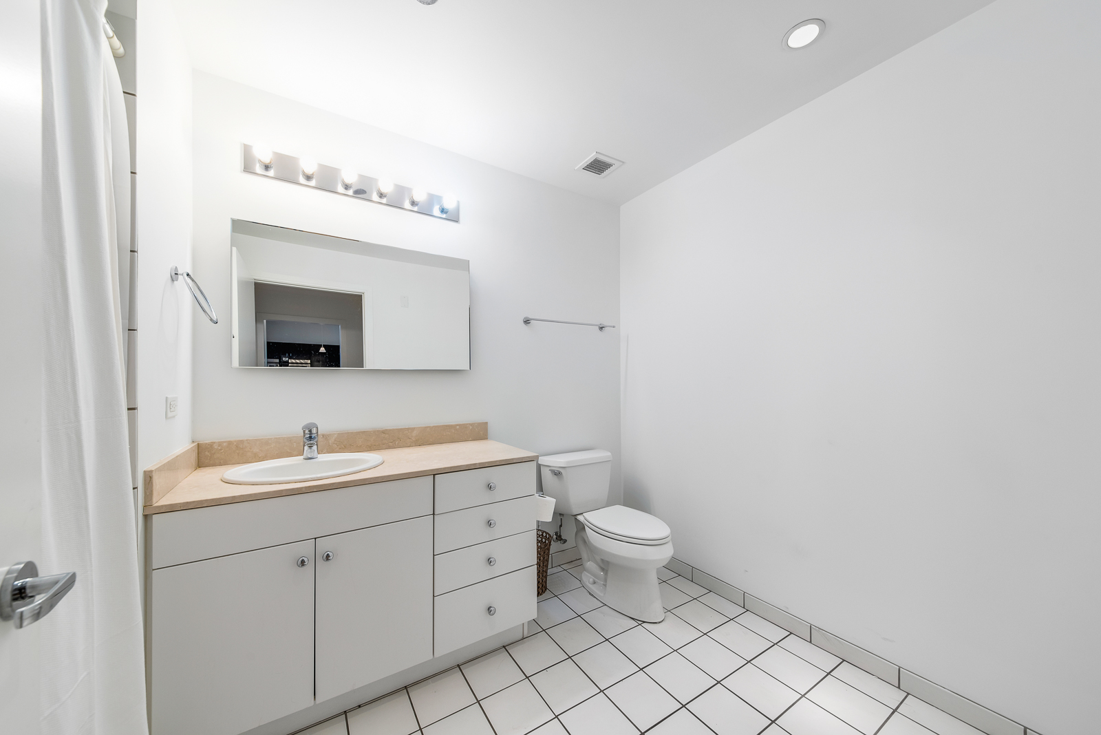 8 East Randolph Street, Unit 2107 Chicago, IL 60601 - Photo 6 of 13 a bathroom with a toilet sink and mirror