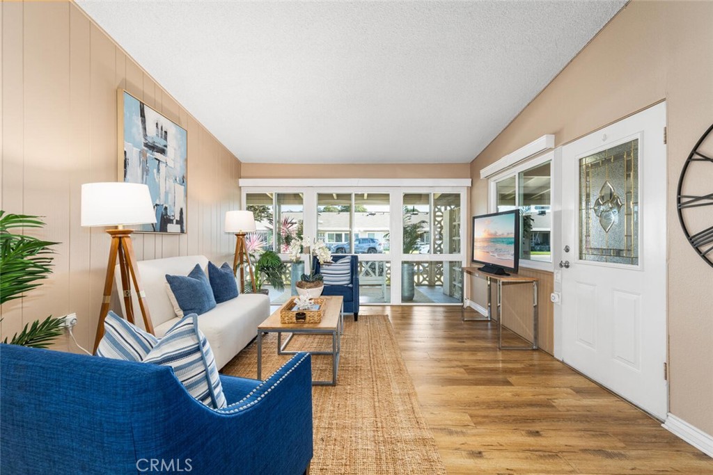 1121 Northwood Road, Unit 237D M9 Seal Beach, CA 90740 - Photo 21 of 45 a living room with furniture and a wooden floor