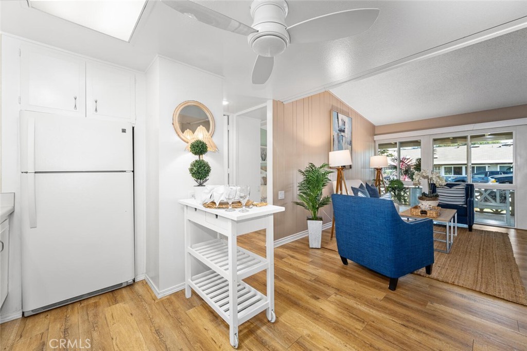 1121 Northwood Road, Unit 237D M9 Seal Beach, CA 90740 - Photo 26 of 45 a living room with furniture and wooden floor