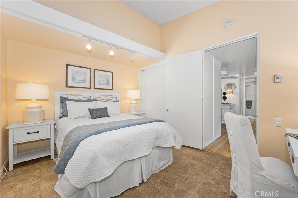 1121 Northwood Road, Unit 237D M9 Seal Beach, CA 90740 - Photo 30 of 45 a spacious bedroom with a bed and furniture