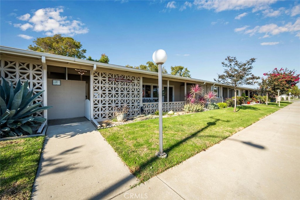 1121 Northwood Road, Unit 237D M9 Seal Beach, CA 90740 - Photo 3 of 45 a view of a house with backyard porch and patio