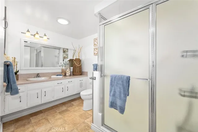 a bathroom with a shower and a toilet