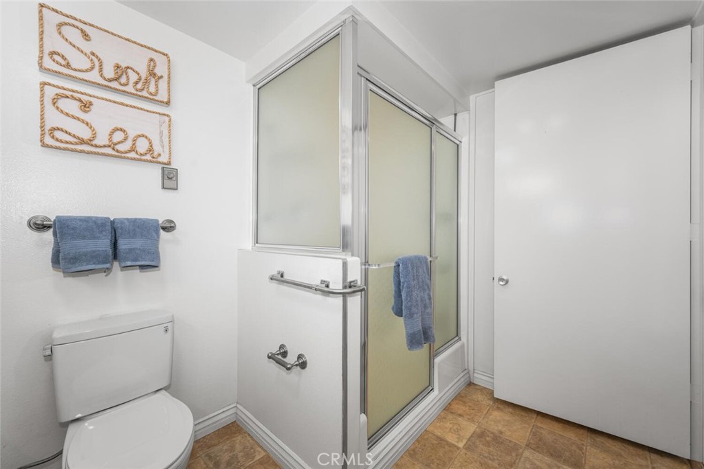 1121 Northwood Road, Unit 237D M9 Seal Beach, CA 90740 - Photo 34 of 45 a bathroom with a shower and a toilet