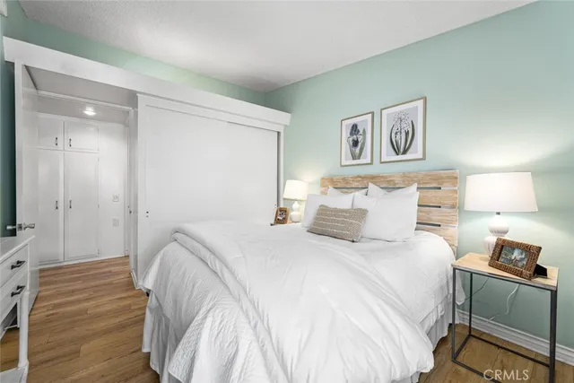 a bedroom with a bed and a mirror