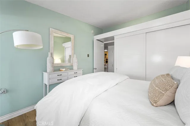 a view of grassy field with benches and trees all around