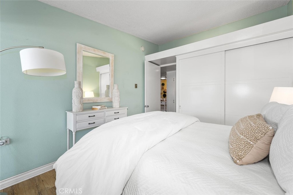 1121 Northwood Road, Unit 237D M9 Seal Beach, CA 90740 - Photo 39 of 45 a bedroom with a bed and a mirror