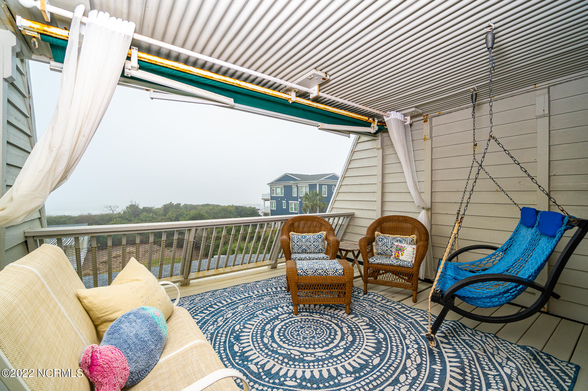 131 Salter Path Road, Unit 1 CORAL BAY WEST Atlantic Beach, NC 28512 - Photo 26 of 77 Private porch off primary suite